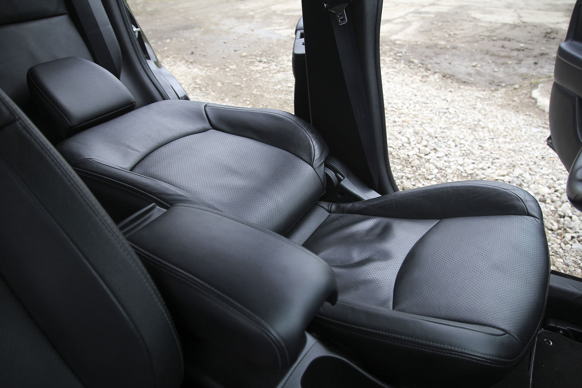 Seatback failure in car - black leather seat